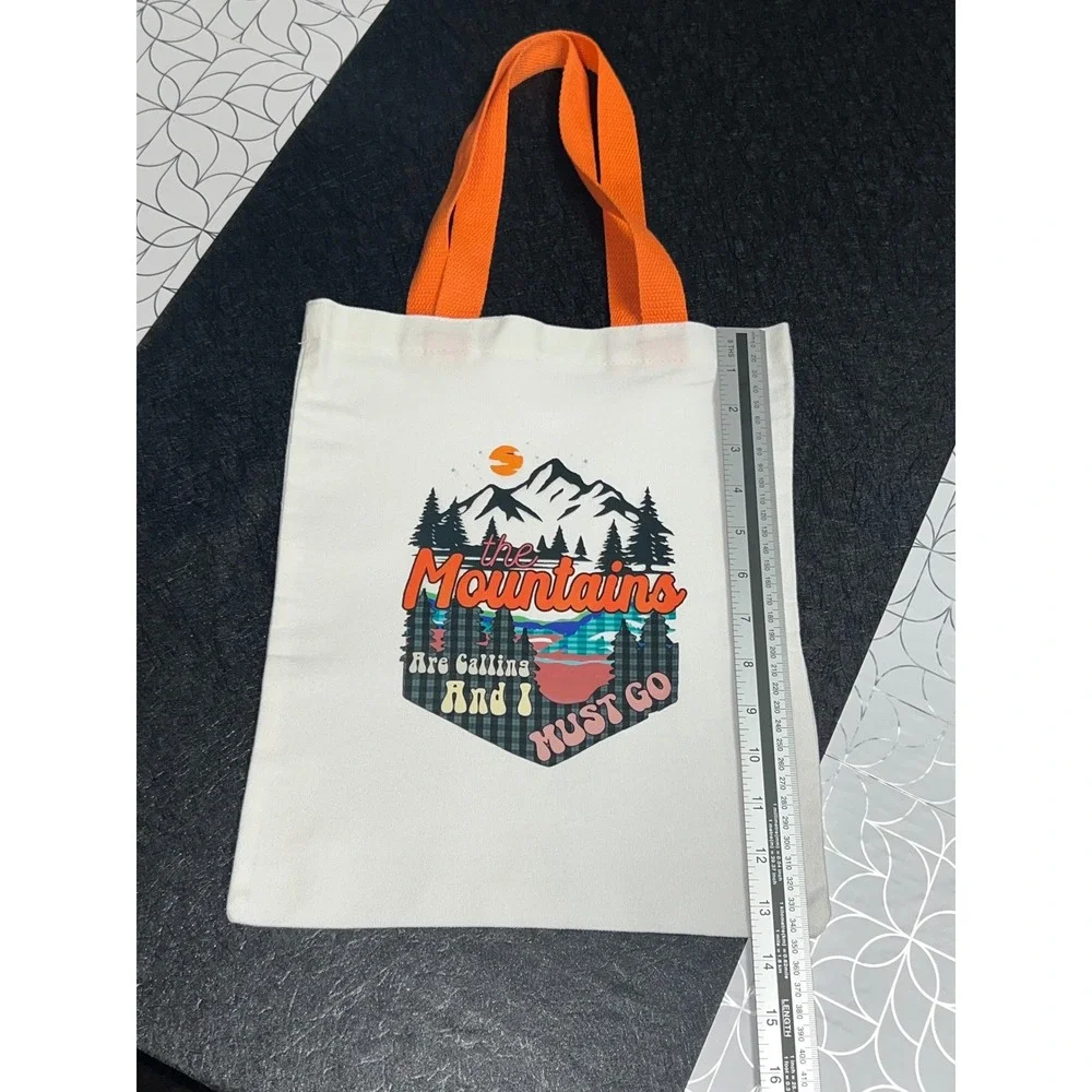 The‎ Mountains Are Calling Graphic Canvas Tote Bag White Orange Trim